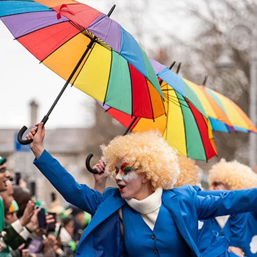 Clown dancing with umbrella
